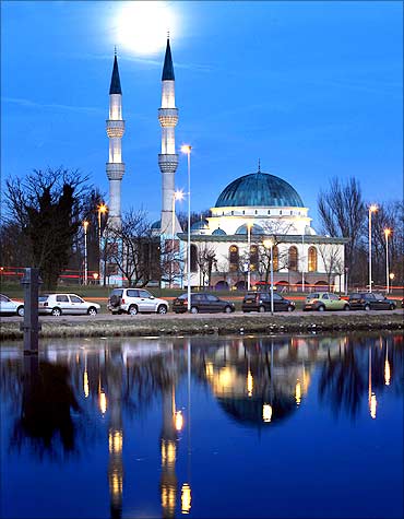 The moon shines over the Mevlana Mosque in Rotterdam