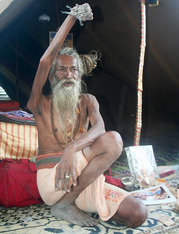 Image: 'Hands up' sadhu does it for world peace - Rediff.com
