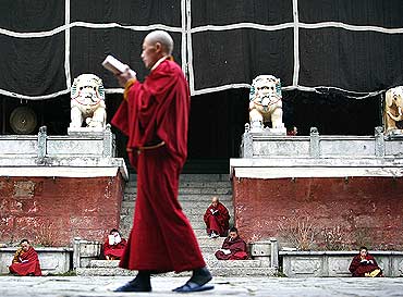 Monks from the Gelugpa sect of Tibetan Buddhism study at the Nanwu temple in Kangding, China
