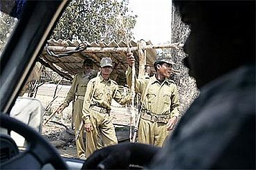 Tribal militia at a checkpost in a forest area in Kutru village, about 450 km south of Raipur