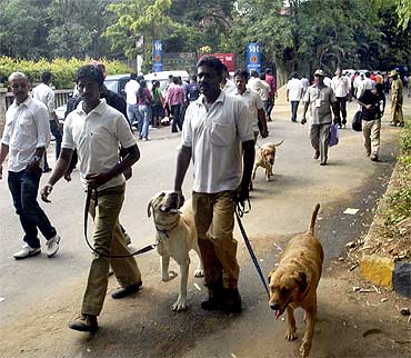 Police teams searching the blast site in Bangalore