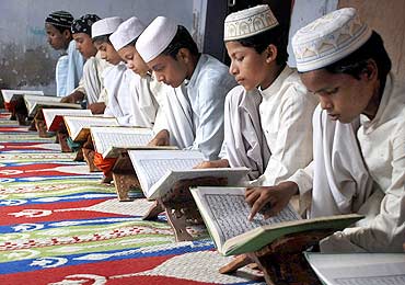 Children read the Koran at a madrasa