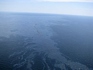 Debris and oil from the Deepwater Horizon drilling platform float in the Gulf of Mexico after the rig sank, off Louisiana on April 22