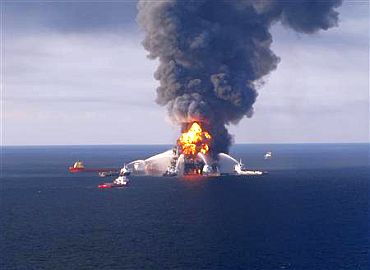 Fire boat response crews battle the blazing remnants of the off shore oil rig Deepwater Horizon, off Louisiana, in this handout photograph taken on April 21 and obtained on April 22