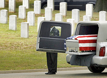 The casket containing the remains of Sergeant Jeffrey Kettle at the burial site in Virginia