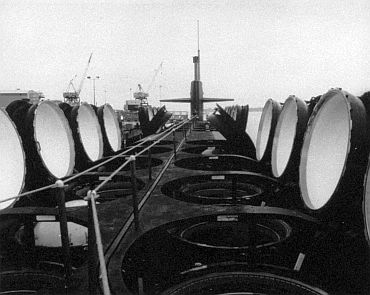 USS Ohio, strategic nuclear submarine of the US Navy. Commissioned in 1981, carries 24 Trident ballistic missiles in a double row of vertical launch tubes (shown with hatches open). The average patrol time at sea of Ohio-class submarines is 70 days, and their nuclear reactor cores need replacement only once every nine years.