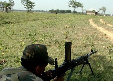 A paramilitary trooper on guard in a Naxal-hit Chhattisgarh village