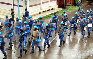 Rapid Action Force men parade through Srinagar streets.