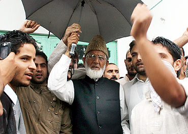 Separatist leader Syed Geelani with his aides in Srinagar