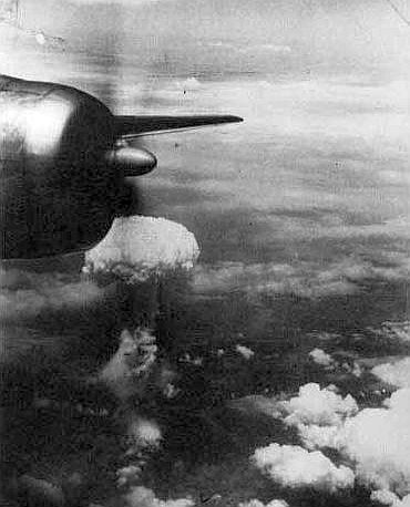 The Hiroshima mushroom cloud, through a window in one of the three B-29s, which went on the bombing run.