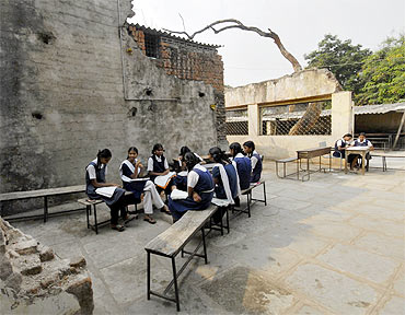 Schoolgirls study in a government-run school in Andhra Pradesh