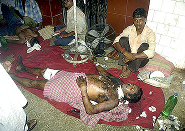 A patient rests on a hospital floor in  Agartala
