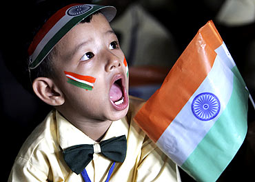 A boy attends Independence Day celebrations at a school