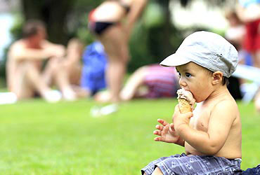 A boy eats an ice cream in Kriens, Switzerland