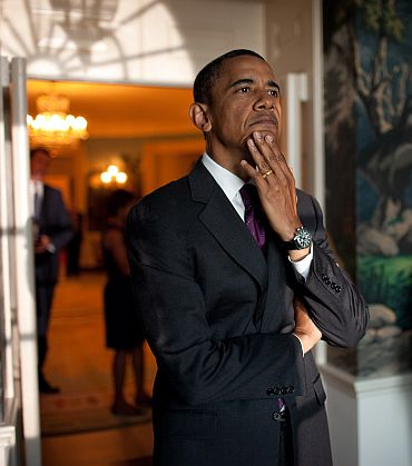President Barack Obama waits in the Diplomatic Reception Room of the White House, prior to an event commemorating the 20th anniversary of the Americans with Disabilities Act on the South Lawn, July 26