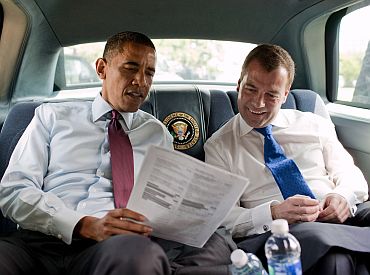 President Barack Obama and Russian President Dmitry Medvedev look at a Ray's Hell Burger menu during their ride to the restaurant in Arlington