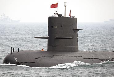 A Chinese submarine takes part in an international fleet review to celebrate the 60th anniversary of PLA