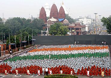 The Children in tricolor formation at the full dress rehearsal of the 64th Independence Day, at Red Fort, in Delhi on August 13, 2010