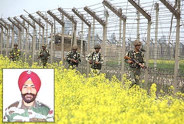 Inset:  Capt Devinder Singh Jass. Photo: Indian soldiers patrol the fenced border with Pakistan