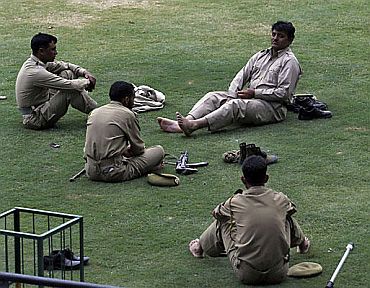 Cops take a break after patrolling duty in Srinagar