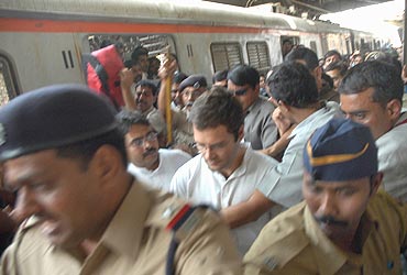 Rahul Gandhi alights from a local train in Mumbai
