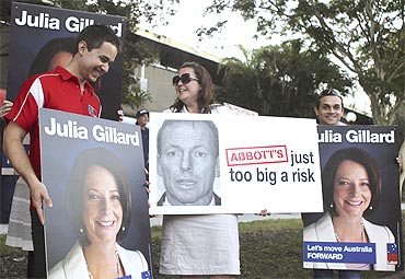 Placards of Prime Minister Julia Gillard and Tony Abbott in Brisbane