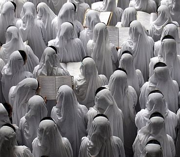 Nuns from the Missionaries of Charity order sing hymns
