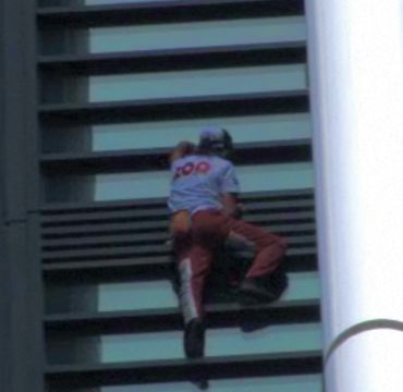 Video grabs show Robert climbing the Sydney skyscraper