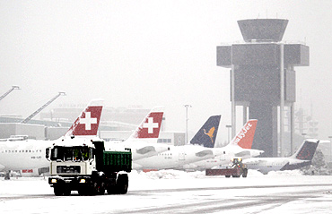 A lorry transports snow at Cointrin airport in Geneva