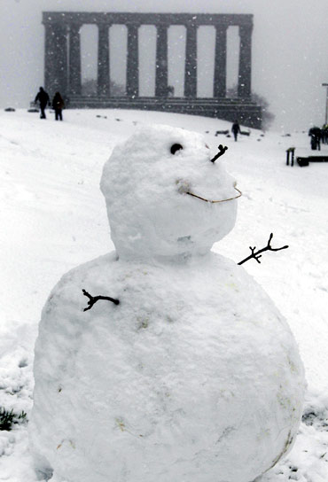 A snowman sits on Calton Hill in Edinburgh, Scotland