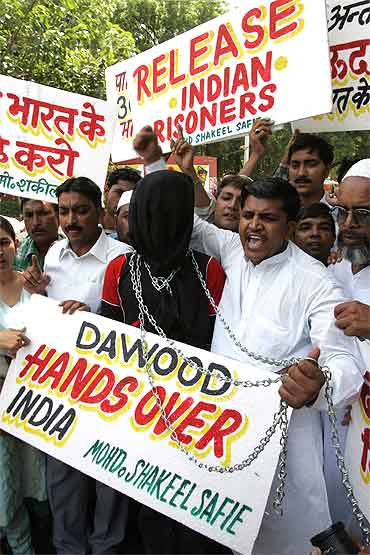 Indians shout slogans during a protest, demanding that Pakistan hand over Dawood Ibrahim