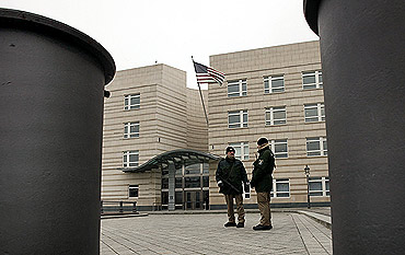 Policemen stand guard at the US embassy in Berlin