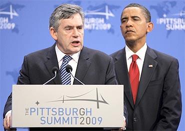 Former British PM Gordon Brown with US President Barack Obama