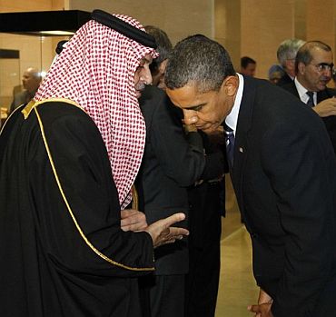 US President Barack Obama talks with Saudi Arabia's Foreign Minister Prince Saud Al-Faisal as they arrive at the National Museum of Korea for dinner in Seoul for the G20 Summit