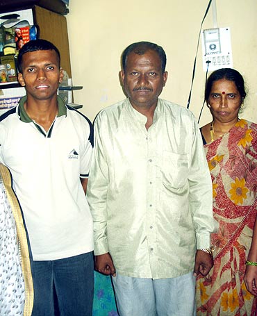 Krishnant with his parents in their Pune home