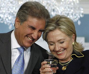 US Secretary of State Hillary Clinton shares a laugh with Pakistan Foreign Minister Shah Mehmood Qureshi