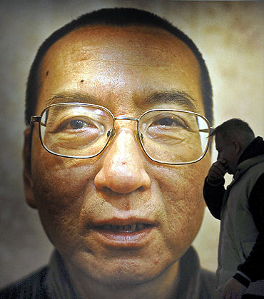 Workers prepare the Nobel Peace Prize laureate exhibition for Chinese dissident Liu Xiaobo at the Nobel Peace Center in Oslo