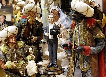 A figure of Wikileaks founder Julian Assange is placed in a Neapolitan Christmas creche by Gennaro Di Virgilio depicting the Nativity of Jesus in Naples