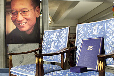 The Nobel certificate and medal is seen on the empty chair where this year's Nobel Peace Prize winner jailed Chinese dissident Liu Xiaobo would have sat