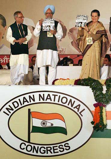 Finance Minister Pranab Mukherjee with Prime Minister Dr Manmohan Singh and Congress President Sonia Gandhi at the plenary