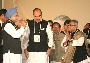 PM with Health Minister Ghulam Nabi Azad (centre) and Finance Minister Pranab Mukherjee (right) at the plenary meet on Monday