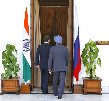 President Medvedev and PM Singh walk before their meeting in New Delhi on Tuesday