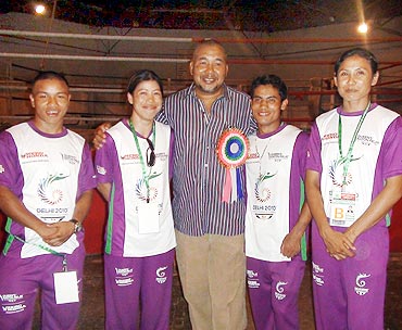 Mary Kom, second from left, with her coach Leishangthem Ibomcha Singh and other boxers
