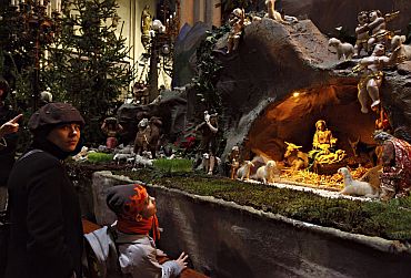 People look at the nativity scene during a Christmas celebration at the Croatian capital Zagreb's Roman Catholic cathedral