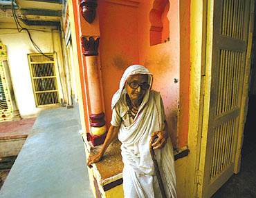 A woman rests in an old age home in the pilgrimage town of Vrindavan