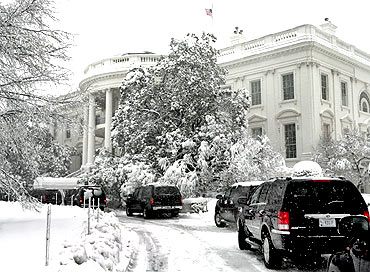 United States President Barack Obama's motorcade stands in front of the White House