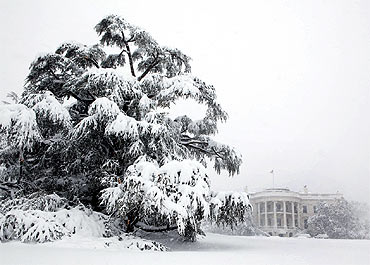 Snow blankets the White House south grounds during a blizzard