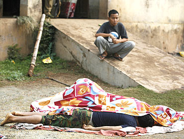 Bodies lie in the grounds of a police camp that was attacked by Maoist rebels