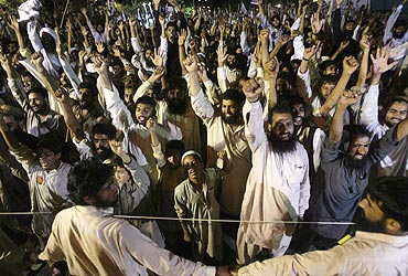 Pakistani activists of the Islamic hardliner party Jamaat-ud-Dawa shout anti-India slogans during a rally in Islamabad