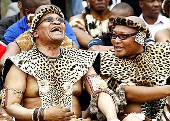 South African President Jacob Zuma (Left) shares a joke with a family member during his traditional wedding to Tobeka Madiba, his fifth wife